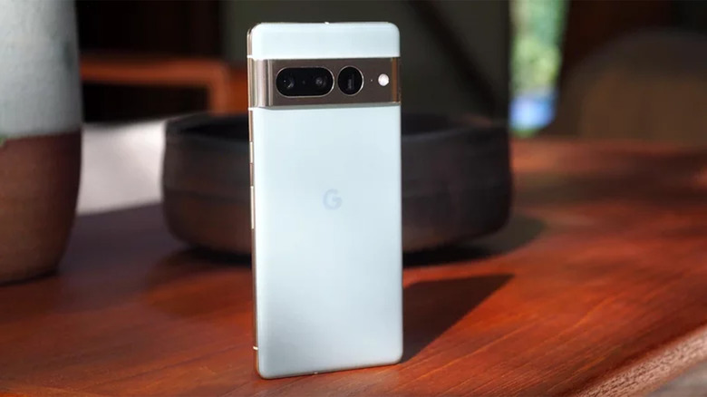 A light blue Pixel 7 Pro on a wood table