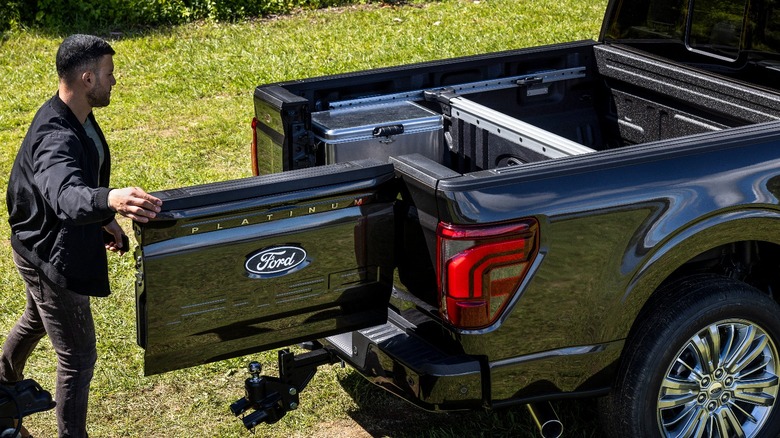 Black Ford F-150 2024 Pro Access tailgate opened