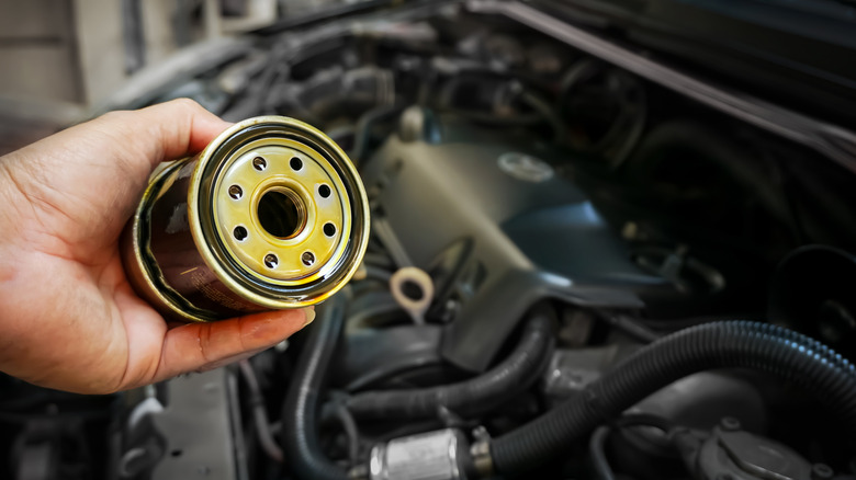 Mechanic changing oil filter