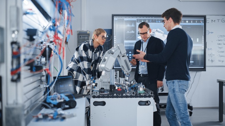 people working on a machine