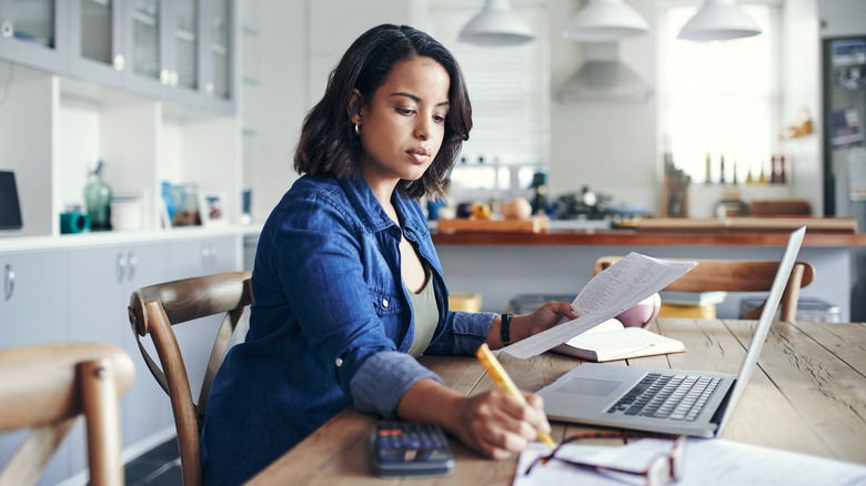 woman using laptop at home