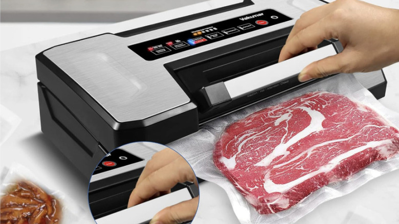 person using vacuum sealer machine