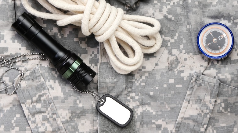 A flashlight with military style accessories