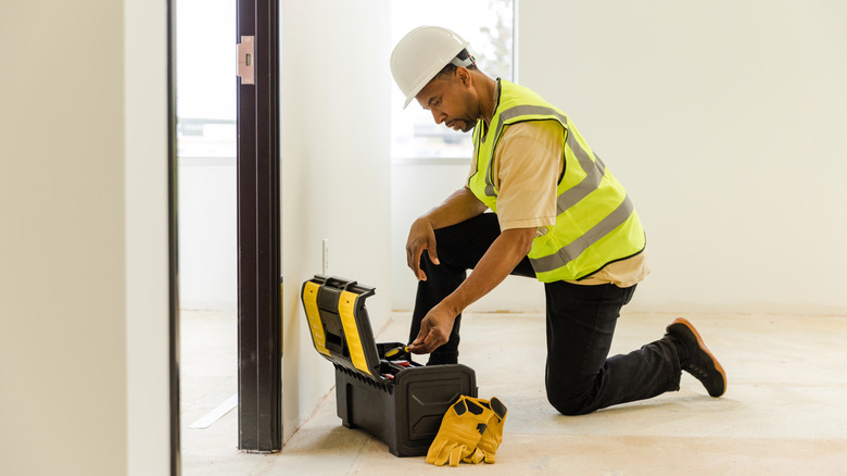 Man using hard hat indoors