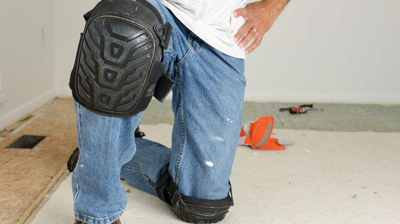 Person using knee pads while working