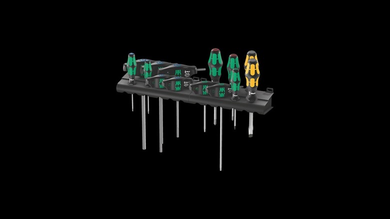 Set of Wera brand green and black screwdrivers on a holder