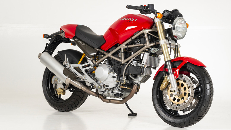 Red Ducati Monster 900 with trellis frame