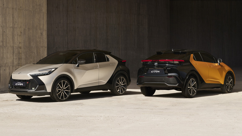 Two 2024 Toyota C-HR SUVs parked opposite of each other