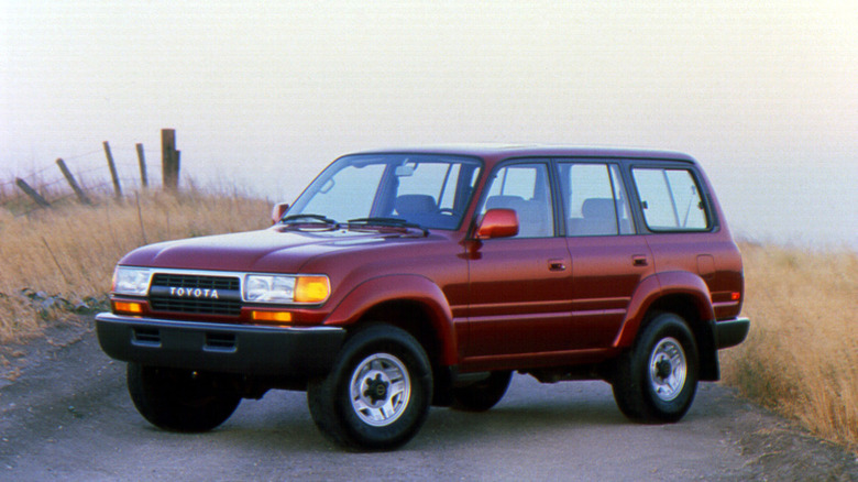 Red 1991 Toyota Land Cruiser FJ80 front 3/4 view