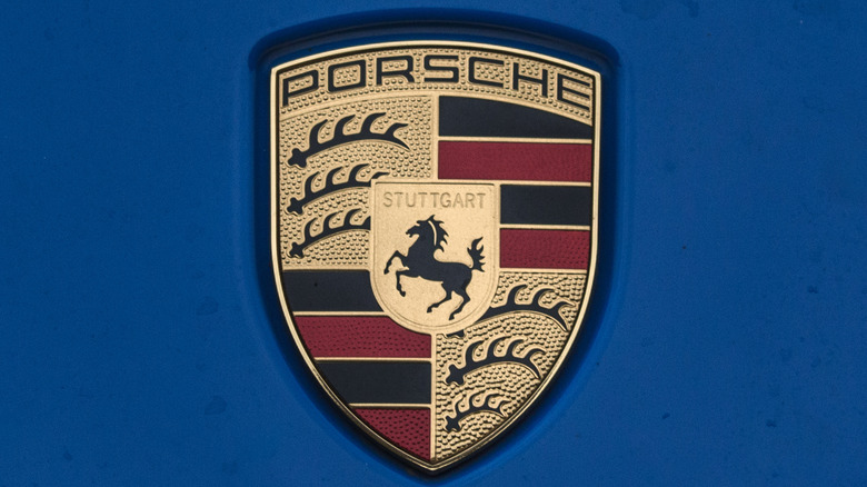 Close up of porsche logo on blue background