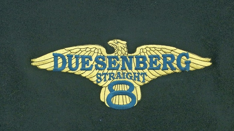 Golden Duesenberg eagle logo