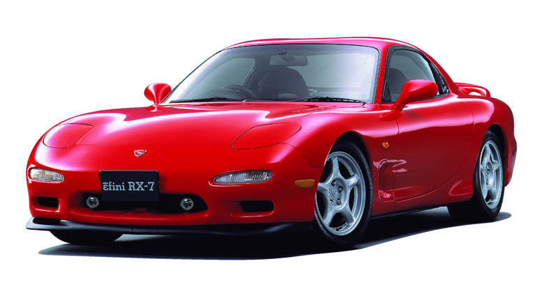 Red Mazda RX-7 FD on white background front 3/4 view