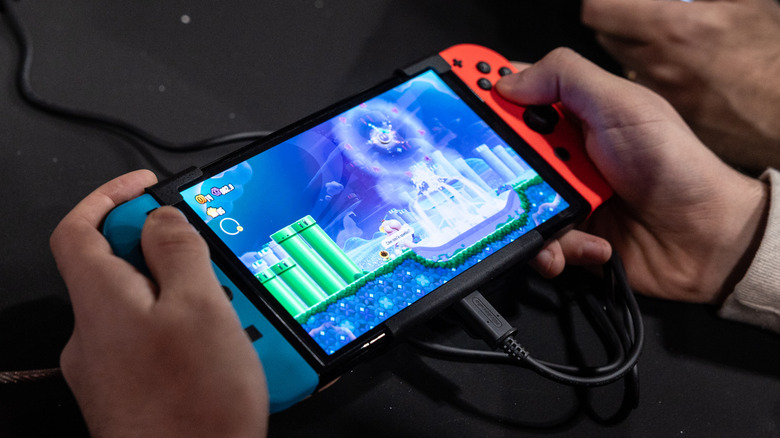 Person playing Nintendo Switch