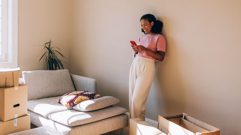 woman smiling in her new apartment