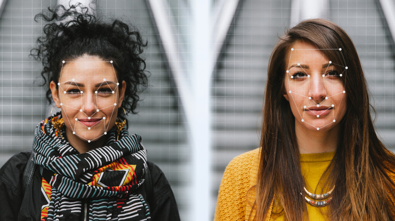 two women with biometric dots on faces