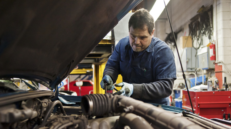 a mechanic working on car