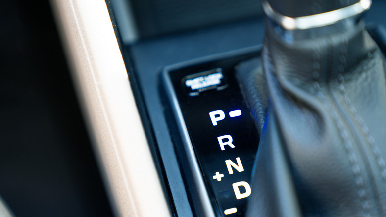 A car's automatic transmission gear shift lever positioned in park