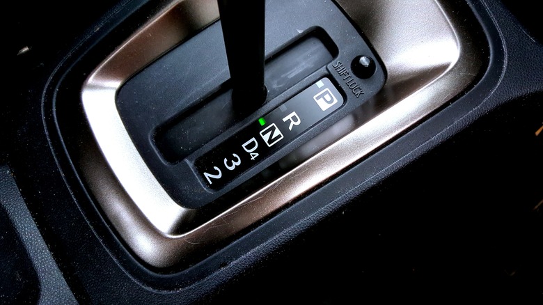 A car's automatic transmission gear shift lever positioned in neutral