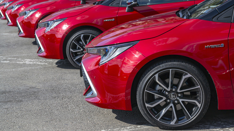 Red Toyota Corollas parked together