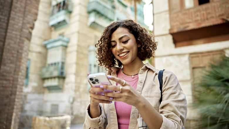 Woman checking her iPhone