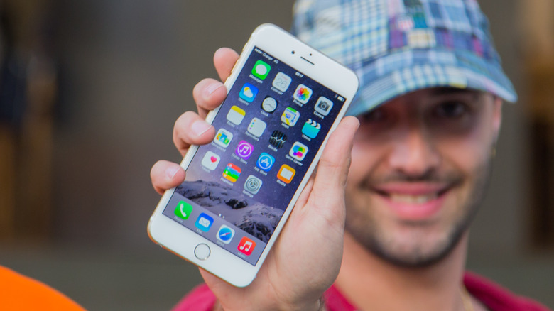 Man showing iPhone home screen