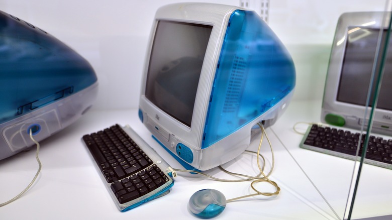 A lineup of classic iMac computers.