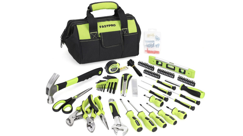 A FASTPRO 220-Piece Home Tool Set with tools beside it.