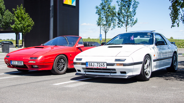Two Mazda RX-7 cars, red and white