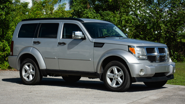 Dodge Nitro parked near trees