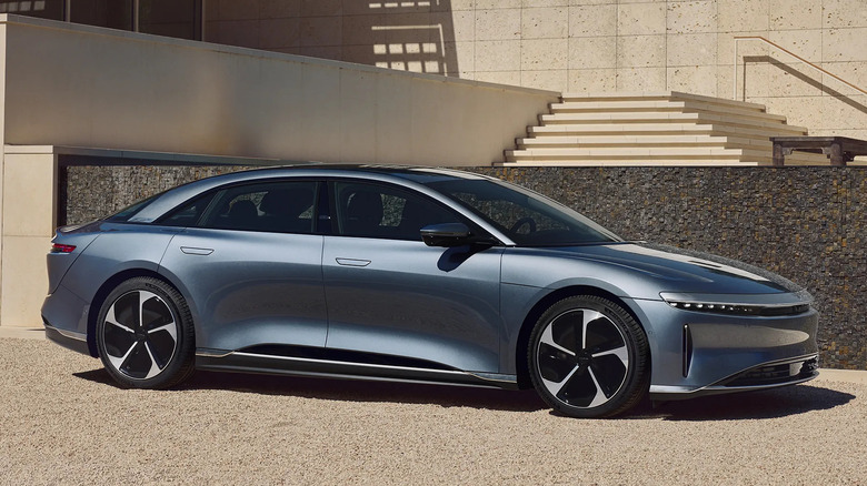 Blue Lucid Air Pure parked in front of building