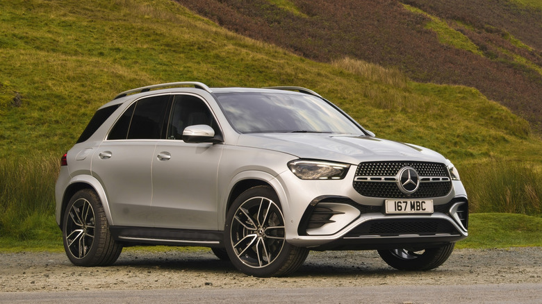 Silver 2024 Mercedes-Benz GLE 400e parked on dirt