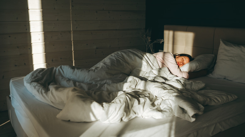 woman sleeping on bed