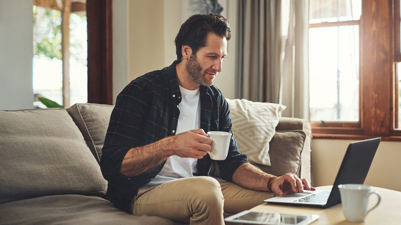 man drinking coffee at home