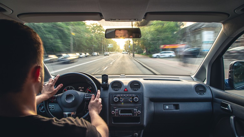 Hands on wheel, driving fast