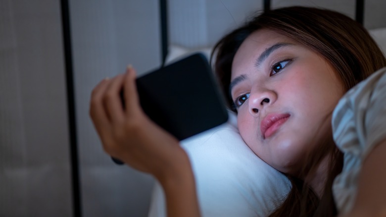 Girl using phone at night