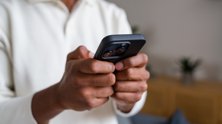 Man holding cell phone