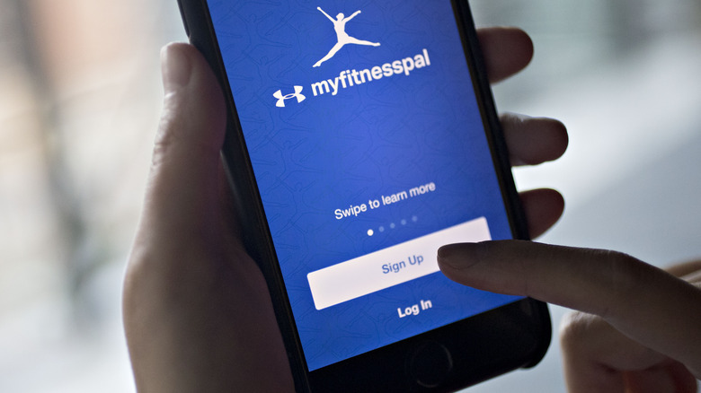 an iPhone user signing up to MyFitnessPal