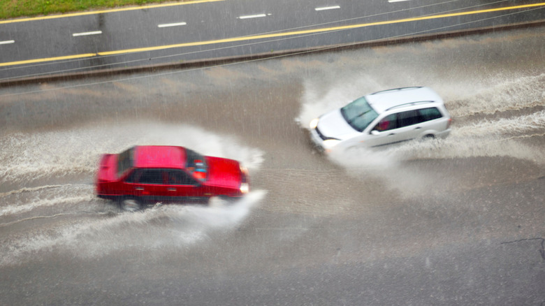 Cars driving in deep water