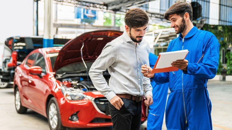 mechanic discussing the car's status