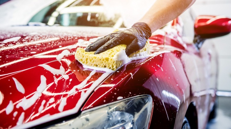 man washing a car