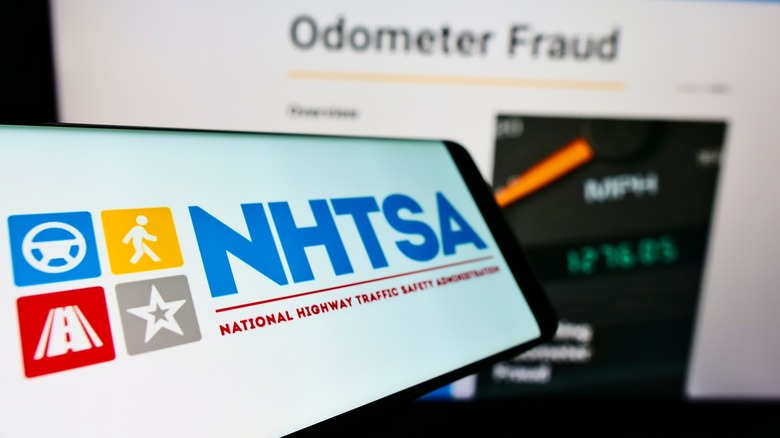 The NHTSA logo on a smartphone