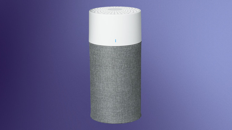 The Blueair air purifier against a gradated blue background