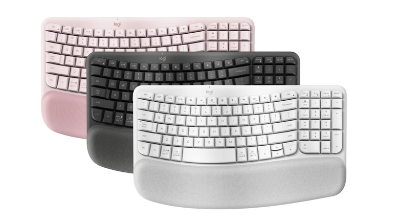 The Wave Keys ergonomic keyboard in three colorways: pink, black and white