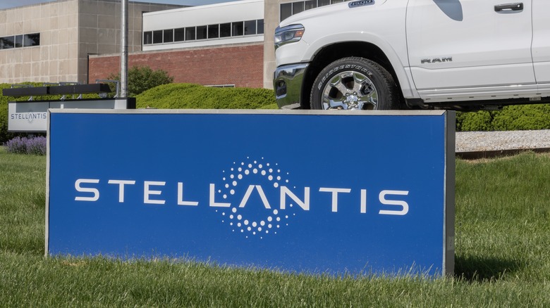 Stellantis sign outside a plant with a Dodge truck in the background