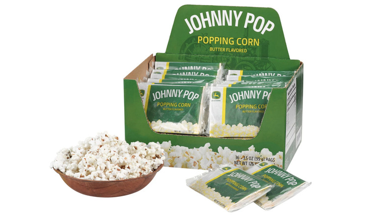 Box of john Deere Johnny Pop Popcorn on white background.