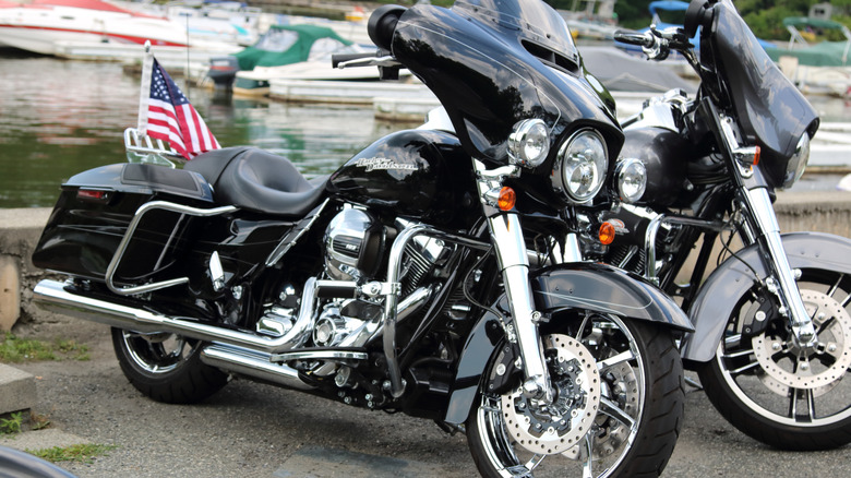 two Harleys resting on their jiffy stands