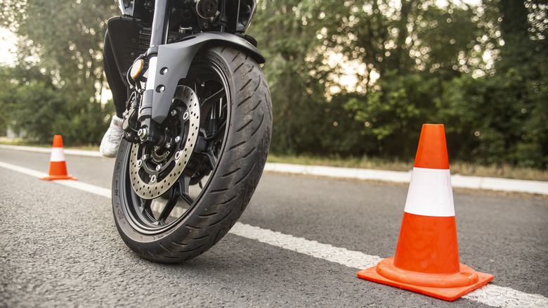 motorcyclist practicing with cones