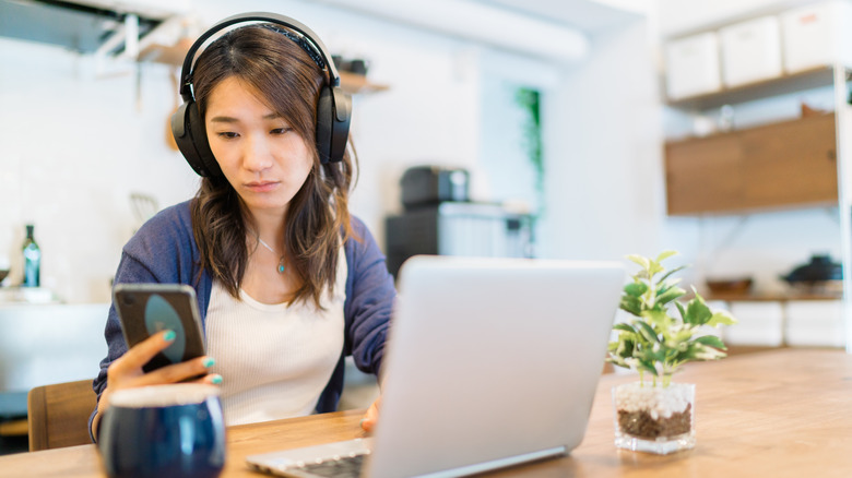 girl working with bluetooth headphones