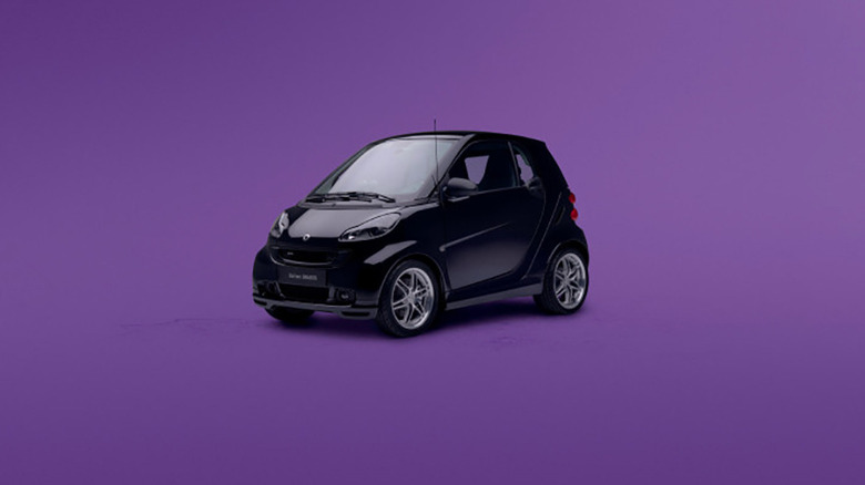 Black Smart Fortwo first generation on purple background