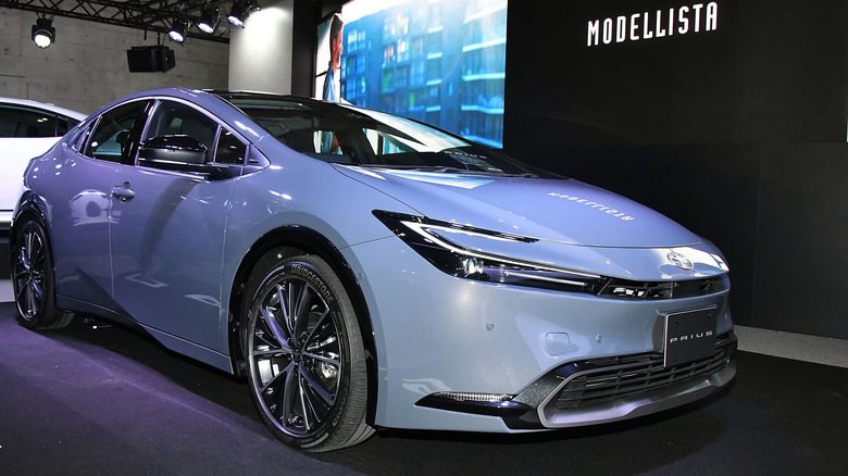 blue Toyota Prius at a car show event